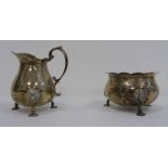 1920's Mappin & Webb silver milk jug and sugar bowl, both with mask decorated feet, London 1927, 6.