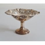 Early 20th century small circular pedestal dish, floral relief decoration to rim, Chester 1908, with