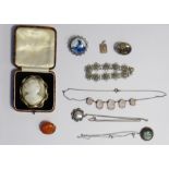 Cameo brooch set in gold-coloured mount, a silver-coloured pendant with turquoise and shell inlay, a