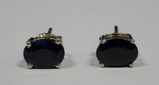 Pair of silver and sapphire oval stud earrings