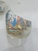 Two Chinese painted glass snuff bottles and two glass covers, the largest painted with buildings and