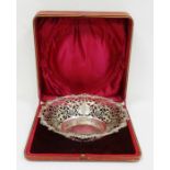Early 20th century silver bowl with pierced scroll rim, scalloped and scroll relief edges, in red