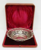 Early 20th century silver bowl with pierced scroll rim, scalloped and scroll relief edges, in red