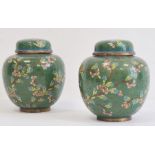 Pair of cloisonne enamelled ginger jars and domed covers, decorated with flowering prunus
