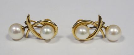 Pair of 14ct gold and pearl earrings, each with single pearl and crossover design and having pearl