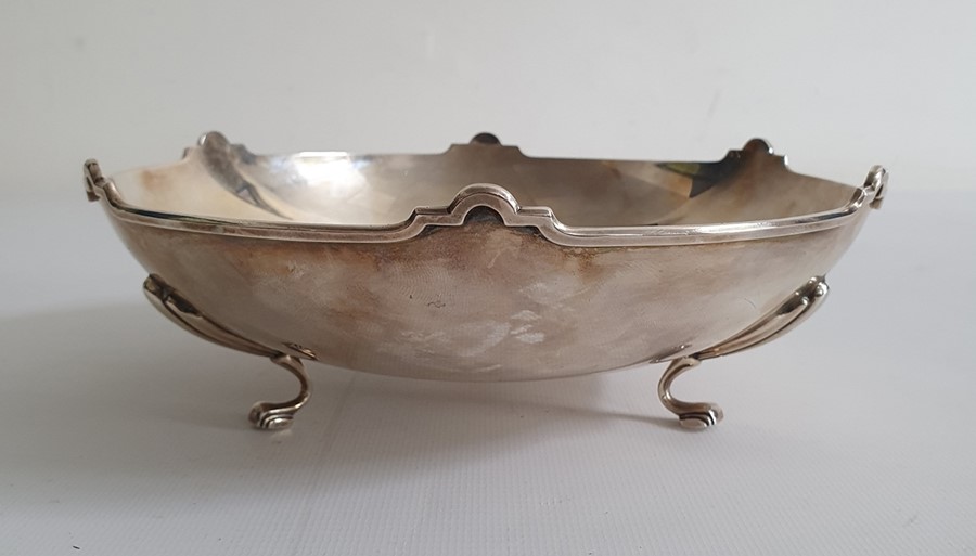 Silver footed presentation bowl by William Hair Haseler, Birmingham 1936, with arched rim, the