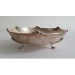 Silver footed presentation bowl by William Hair Haseler, Birmingham 1936, with arched rim, the