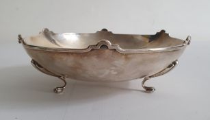 Silver footed presentation bowl by William Hair Haseler, Birmingham 1936, with arched rim, the