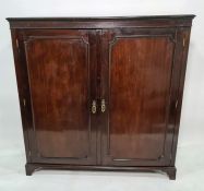 19th century mahogany cupboard, the rectangular top with moulded edge above two doors enclosing