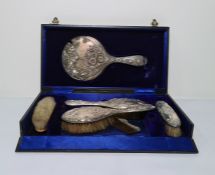 George V silver dressing table set viz:- hand mirror, pair hair brushes, pair clothes brushes and