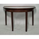 Mahogany demi-lune side table on square-sectioned tapering supports, 122cm wide