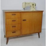 Bernina sewing machine cabinet and a quantity of sewing itemsCondition ReportThe sewing machine
