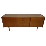 20th century teak sideboard with two sliding doors and four central drawers, raised on turned