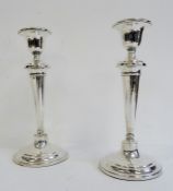 Pair of early 20th century silver-mounted candlesticks, tapering, on circular base, Birmingham,