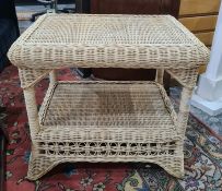 A wicker conservatory square two-tiered coffee table