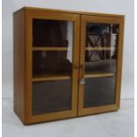 Teak two-door cabinet with two glazed doors enclosing shelves, 75 x 72cm