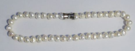 Modern string of baroque pearls with silver clasp