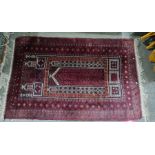 Eastern rug, red ground, stepped border, red plaques and white, 132cm x 90cm