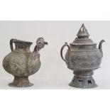 Two Asian copper tea kettles, each of globular form, the first with cover and spire finial, the