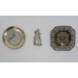 White metal and foreign silver wares to include pin dish, embossed and pierced tray and rattle in