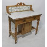 19th century pine washstand with tiled back, white marble tops, single drawer above a cupboard door,