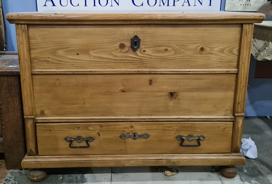 Pine mule type chest with lift-top above a single drawer, turned feet