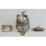 Silver-coloured metal lidded large pot with branch and leaf finial, engraved decorations of