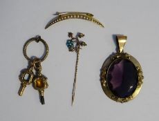 Gilt metal and pale amethyst coloured stone pendant, two ornate watch keys, a gold coloured metal