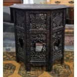 Anglo-Indian octagonal centre table with relief carved top with allover foliate decoration on