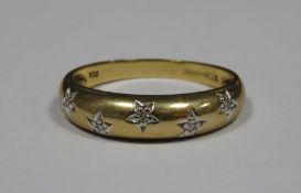 9ct gold and diamond dress ring set five small diamonds in star setting, 1.9g approx Condition