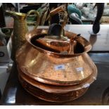 Copper kettle, a brass pitcher, two copper bowls and an embossed copper platter (5)