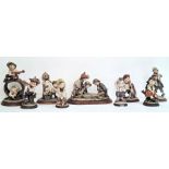 Nine Capodimonte figures by G Amani to include 'Gullivers World' and other figures of children at