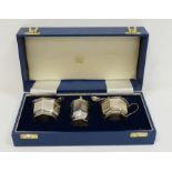 Early 20th century silver cased cruet set with blue glass liners, Birmingham 1913, makers Mappin &