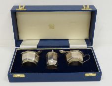 Early 20th century silver cased cruet set with blue glass liners, Birmingham 1913, makers Mappin &