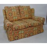 Modern two seater sofa in yellow, green and red upholstery