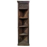 African-style corner shelving unit with heavily carved decoration, on plinth base, 183cm high