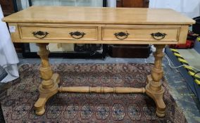 19th century pine side table, the rectangular top with rounded corners with two drawers, turned