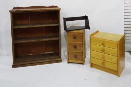 Pine open bookcase, chest of three drawers, chest of four drawers, and a book rack (4)