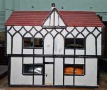 Tudor style cottage doll's house with some furniture