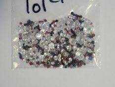 Bag of loose mixed stones including cubic zirconia, ruby, sapphire, emerald, amethyst, garnet and