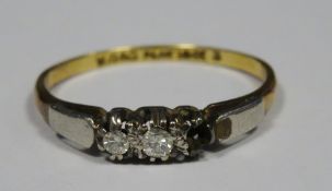 Platinum, 18ct gold and three stone diamond ring set three small stones (one missing)