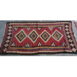 Modern rug, red ground with stepped diamond-shaped medallions, stepped border, 242cm x 114cm