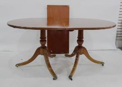 Mahogany and crossbanded D-end Regency style dining table with reeded edge raised on two pedestals