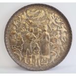 Eastern brass circular tray decorated with a western lady and gentleman shaking hands surrounded