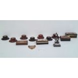 Quantity of enamel and other badges, assorted buttons, money boxes, wooden trophy stands, postcards,