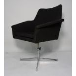 Mid-20th century black weave tub chair on chrome swivel supports to quatrefoil base