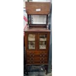 Late 19th century mahogany and strung music cabinet with two glazed doors enclosing shelves above