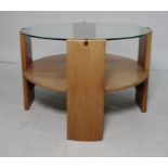 Circular two-tier coffee table, the glass top over four supports, teak under-tier, 63cm dia.