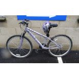 Apollo FEM TB dual 14" bicycle with a bell and bike helmet