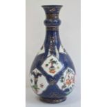 19th century Chinese porcelain powder blue ground famille verte bottle-shaped vase with blue